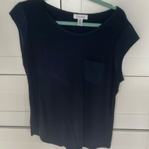 Calvin Klein top with pocket different fabric sleeve and collar.
